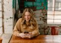 Borrower checking a loan account on a smartphone: After the Loan Is Approved, Borrowers Still Deserve Real Support
