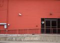 Security camera and rear entrance on a commercial building: Crime Risk for UK Firms: Why Nearly a Third Could Be Victims This Year