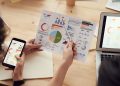 Evaluating Agency Expertise Starts With Their Results in Your Own Industry: marketing specialists reviewing SEO and campaign analytics charts at a desk