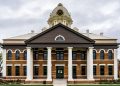 Historic county courthouse with white columns, illustrating Georgia premises liability law